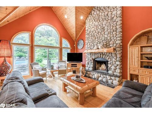 697 Lafontaine Road E, Tiny, ON - Indoor Photo Showing Living Room With Fireplace