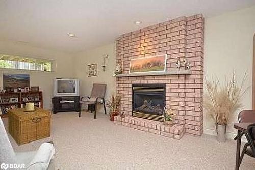 28-150 Bella Vista Trail, Alliston, ON - Indoor Photo Showing Living Room With Fireplace