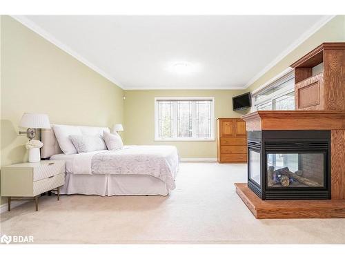 138 Knox Road E, Wasaga Beach, ON - Indoor Photo Showing Bedroom With Fireplace