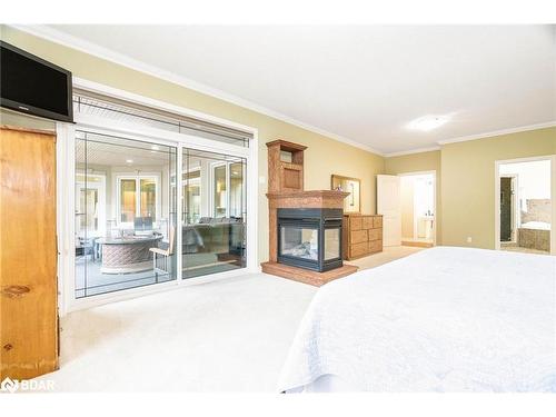 138 Knox Road E, Wasaga Beach, ON - Indoor Photo Showing Bedroom With Fireplace