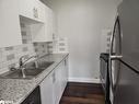 107-8800 Willoughby Drive, Niagara Falls, ON  - Indoor Photo Showing Kitchen With Double Sink 