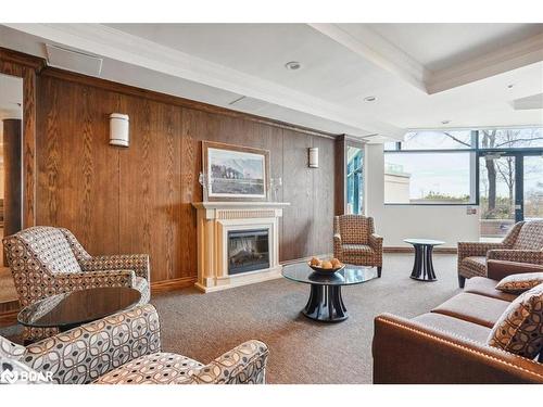 703-33 Ellen Street, Barrie, ON - Indoor Photo Showing Living Room With Fireplace