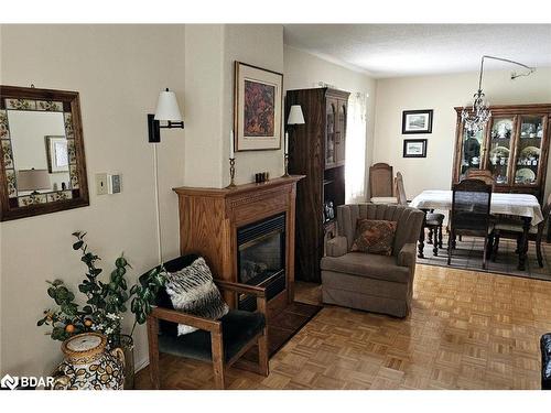 103-54 Fittons Road W, Orillia, ON - Indoor Photo Showing Living Room With Fireplace