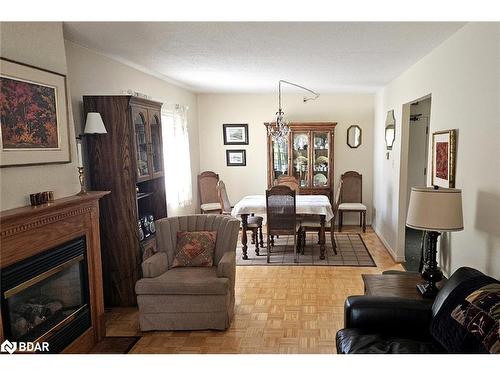 103-54 Fittons Road W, Orillia, ON - Indoor Photo Showing Living Room With Fireplace