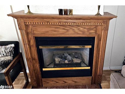 103-54 Fittons Road W, Orillia, ON - Indoor Photo Showing Living Room With Fireplace