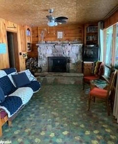 1002 East Camp Lake Rd, Lake Of Bays, ON - Indoor Photo Showing Living Room With Fireplace