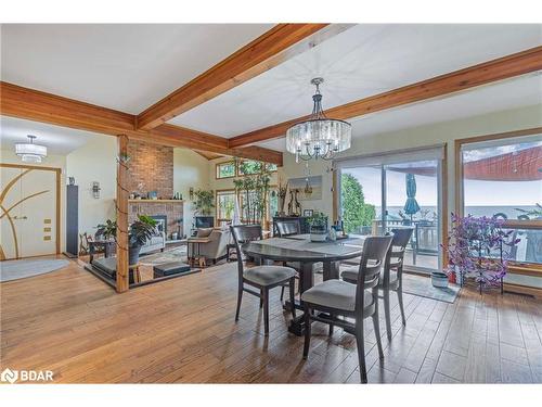 3539 Crescent Harbour Road Road, Innisfil, ON - Indoor Photo Showing Dining Room With Fireplace