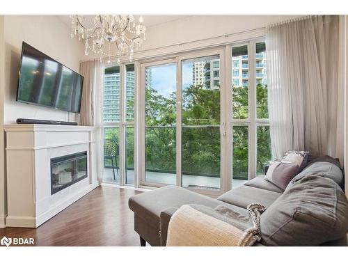 308-60 Absolute Avenue, Mississauga, ON - Indoor Photo Showing Living Room With Fireplace