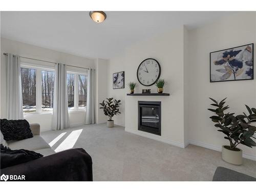 33 Atlantis Drive, Orillia, ON - Indoor Photo Showing Living Room With Fireplace