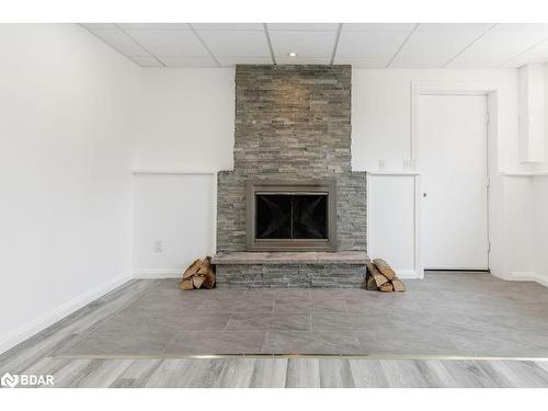 7765 5Th Line, Angus, ON - Indoor Photo Showing Living Room With Fireplace