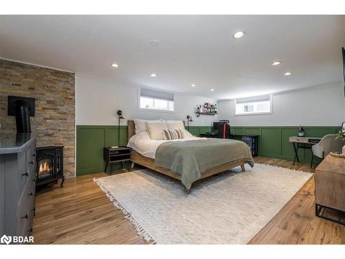 11 Murray Street, Orillia, ON - Indoor Photo Showing Bedroom With Fireplace