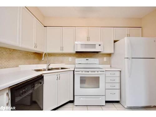 103-25 Meadow Lane, Barrie, ON - Indoor Photo Showing Kitchen With Double Sink