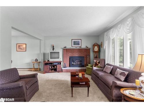 3093 26 Highway, Springwater, ON - Indoor Photo Showing Living Room With Fireplace