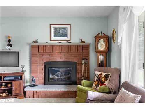 3093 26 Highway, Springwater, ON - Indoor Photo Showing Living Room With Fireplace