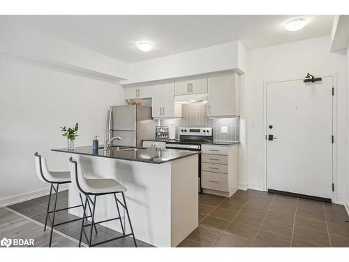 213-4 Spice Way, Barrie, ON - Indoor Photo Showing Kitchen With Stainless Steel Kitchen