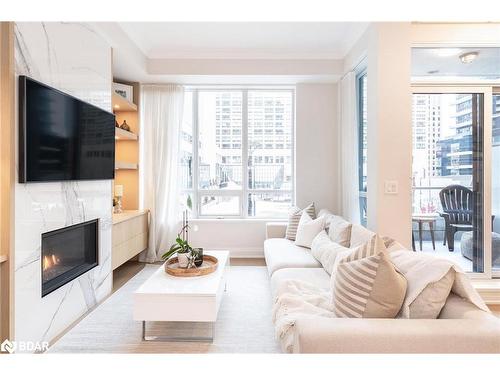 Th01-761 Bay Street, Toronto, ON - Indoor Photo Showing Living Room With Fireplace