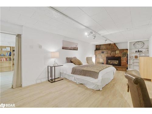 97 Puget Street, Barrie, ON - Indoor Photo Showing Bedroom With Fireplace