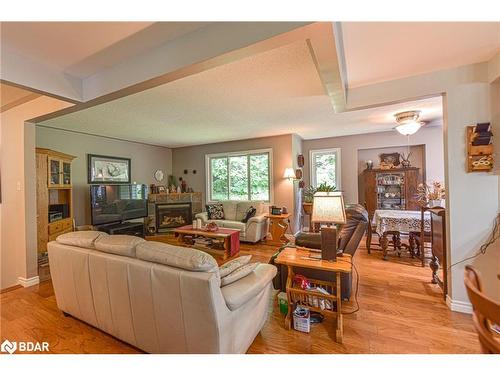 3330 Line 6 North Line, Sugarbush, ON - Indoor Photo Showing Living Room With Fireplace