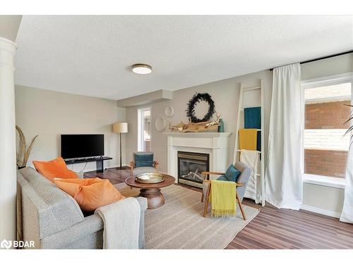 1067 Leslie Drive, Alcona, ON - Indoor Photo Showing Living Room With Fireplace