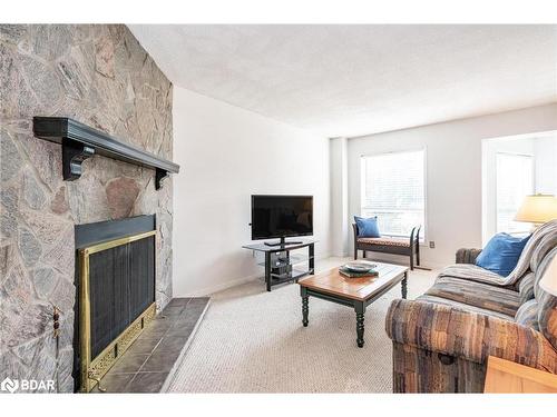 38 River Ridge Road, Barrie, ON - Indoor Photo Showing Living Room With Fireplace