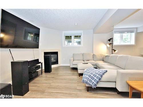 1117 Westmount Avenue, Innisfil, ON - Indoor Photo Showing Living Room With Fireplace