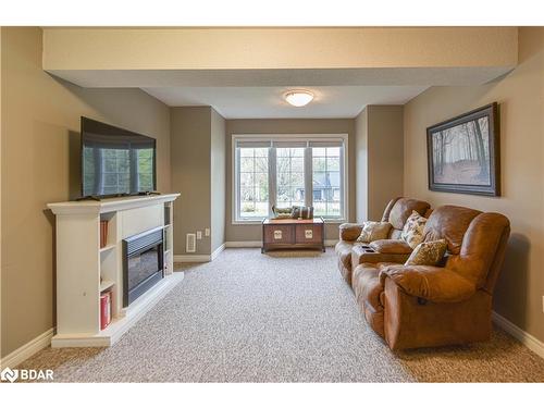 24 Nordic Trail, Shanty Bay, ON - Indoor Photo Showing Living Room With Fireplace