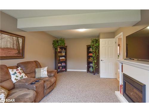 24 Nordic Trail, Shanty Bay, ON - Indoor Photo Showing Living Room With Fireplace