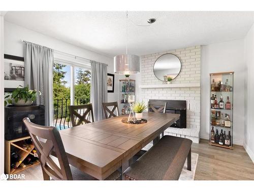 912 Sloan Circle Drive, Innisfil, ON - Indoor Photo Showing Dining Room With Fireplace