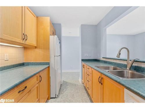 208-110 Steamship Bay, Gravenhurst, ON - Indoor Photo Showing Kitchen With Double Sink