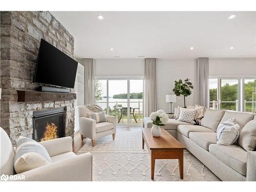 A203/204-1869 Highway 118 Road W, Bracebridge, ON - Indoor Photo Showing Living Room With Fireplace