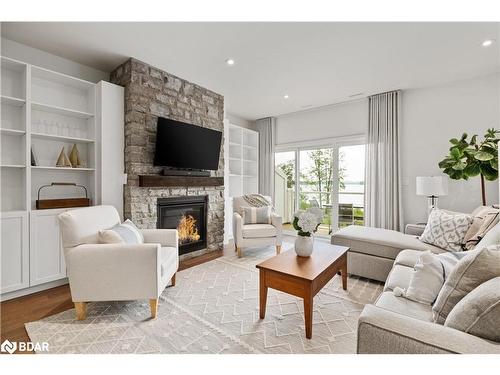 A203/204-1869 Highway 118 Road W, Bracebridge, ON - Indoor Photo Showing Living Room With Fireplace