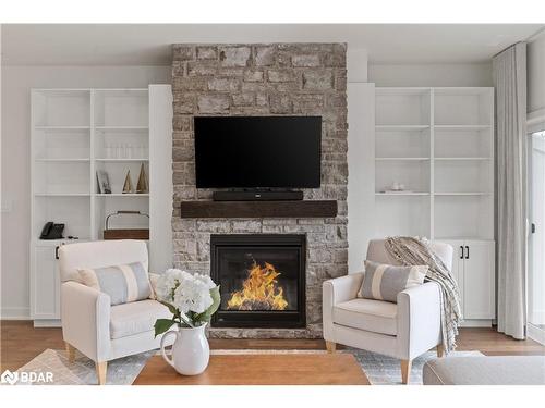 A203/204-1869 Highway 118 Road W, Bracebridge, ON - Indoor Photo Showing Living Room With Fireplace