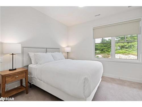 A203/204-1869 Highway 118 Road W, Bracebridge, ON - Indoor Photo Showing Bedroom