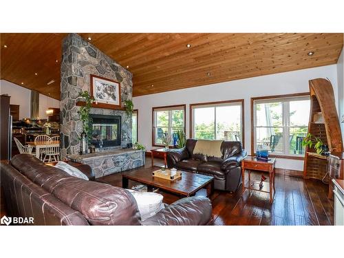 65 Big Sound Road, Mcdougall, ON - Indoor Photo Showing Living Room With Fireplace