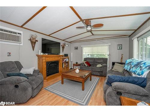 47-5216 County Road 90, Springwater, ON - Indoor Photo Showing Living Room With Fireplace