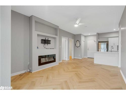 406-295 Cundles Road E, Barrie, ON - Indoor Photo Showing Living Room With Fireplace