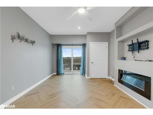 406-295 Cundles Road E, Barrie, ON - Indoor Photo Showing Living Room With Fireplace