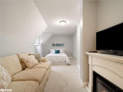 8-5 Invermara Court Court, Orillia, ON - Indoor Photo Showing Living Room With Fireplace