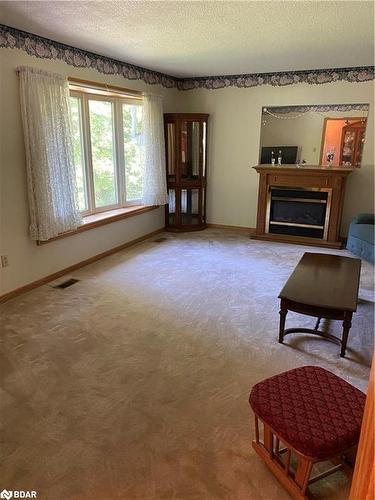 369 Indian Trail, Huntsville, ON - Indoor Photo Showing Living Room With Fireplace