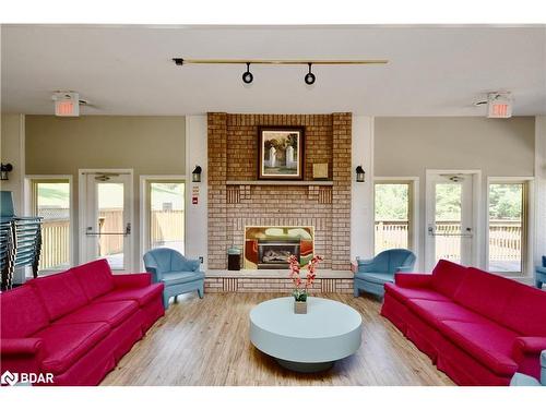 204-25 Meadow Lane, Barrie, ON - Indoor Photo Showing Living Room With Fireplace