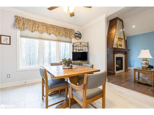 28 Timber Wolf Trail, Minesing, ON - Indoor Photo Showing Dining Room With Fireplace