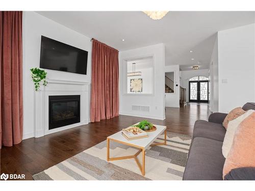 61 Oliver'S Mill Road, Springwater, ON - Indoor Photo Showing Living Room With Fireplace