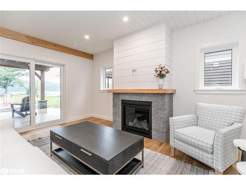 8-1841 Muskoka Road 118 W, Bracebridge, ON - Indoor Photo Showing Living Room With Fireplace