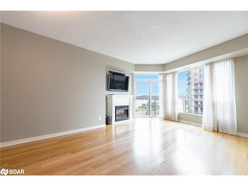 707-33 Ellen Street, Barrie, ON - Indoor Photo Showing Living Room With Fireplace