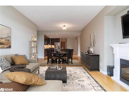 707-33 Ellen Street, Barrie, ON - Indoor Photo Showing Living Room With Fireplace