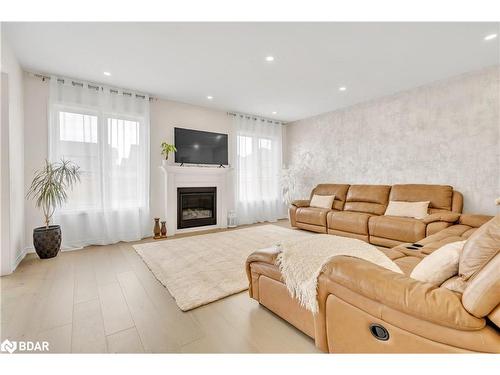 16 Samuel Crescent, Springwater, ON - Indoor Photo Showing Living Room With Fireplace