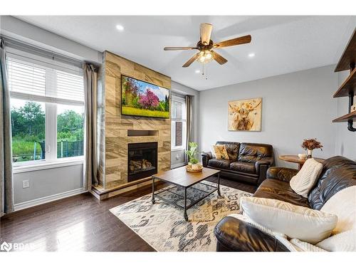 100 Mount Crescent, Angus, ON - Indoor Photo Showing Living Room With Fireplace