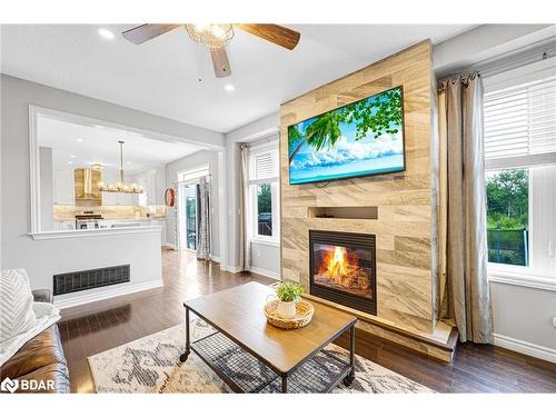 100 Mount Crescent, Angus, ON - Indoor Photo Showing Living Room With Fireplace