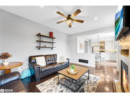 100 Mount Crescent, Angus, ON - Indoor Photo Showing Living Room With Fireplace