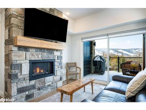 307-12 Beckwith Lane, The Blue Mountains, ON - Indoor Photo Showing Living Room With Fireplace